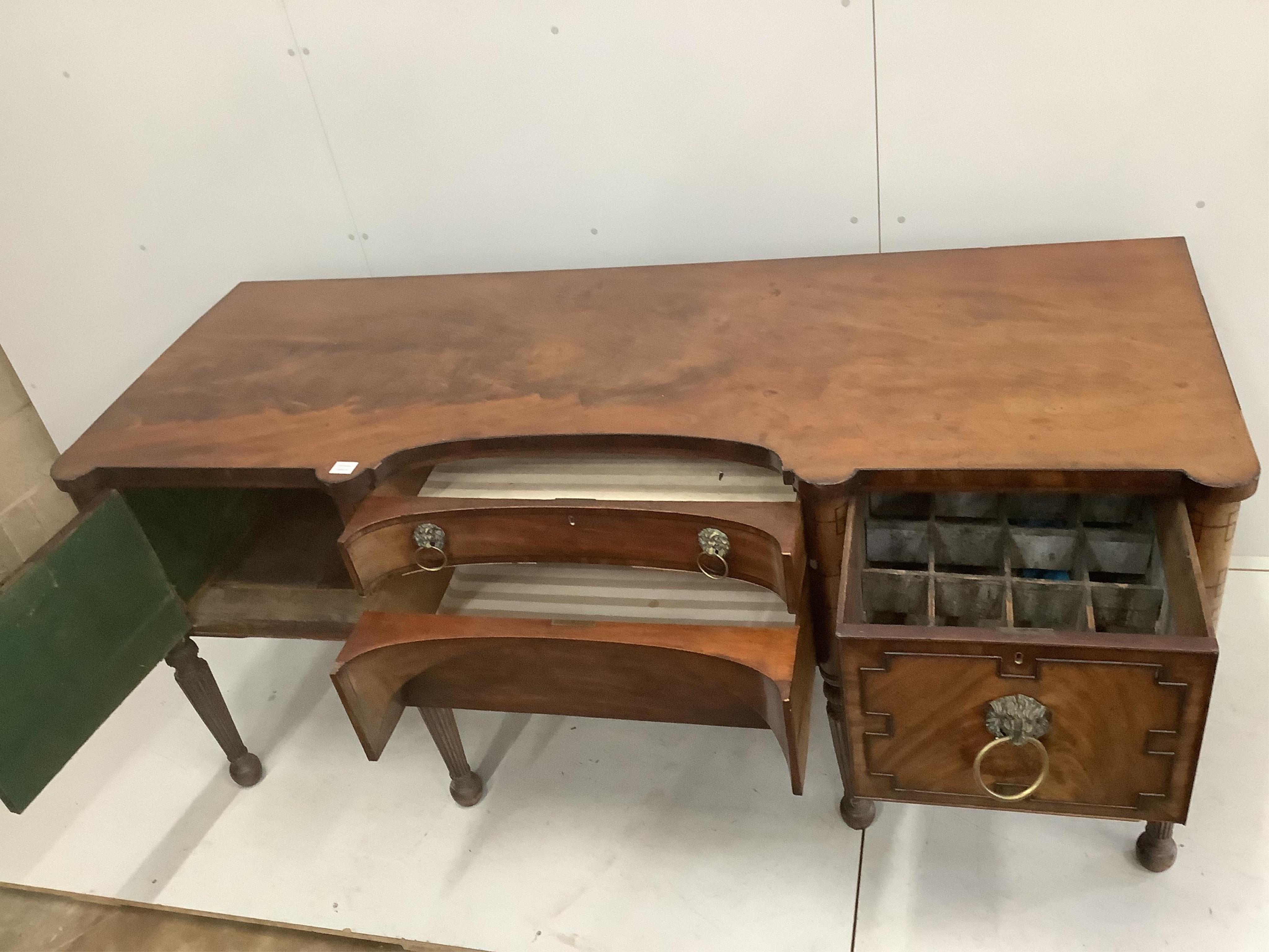 A Regency mahogany sideboard, with a concave front, width 199cm, depth 76cm, height 90cm. Condition - fair